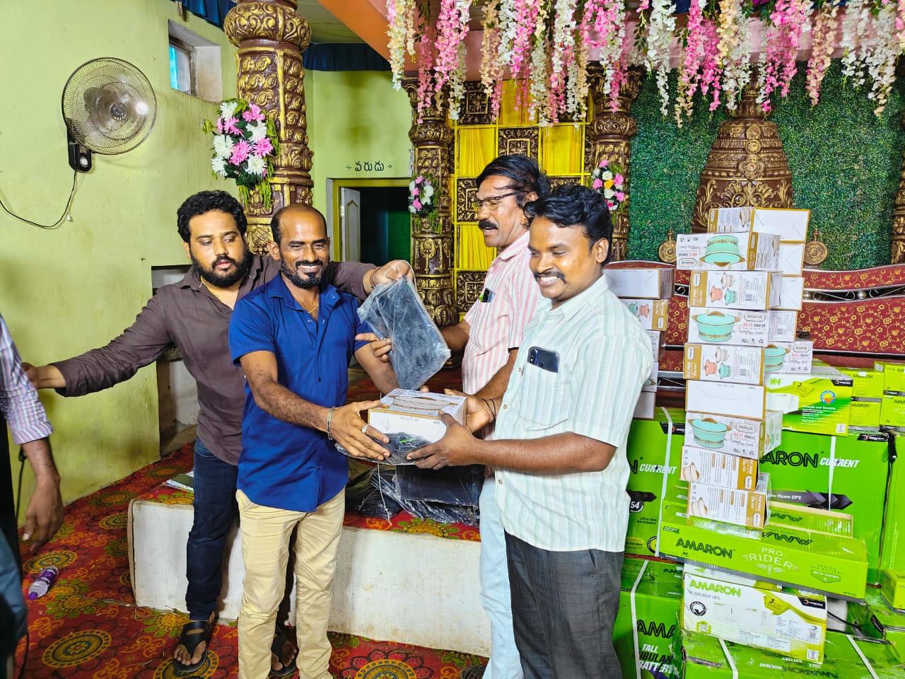 SSV Agencies team handing over products at event